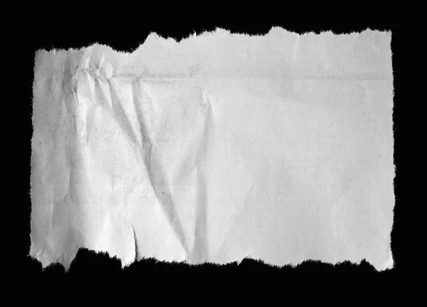 Roztrhaný papír na černém pozadí — Stock fotografie