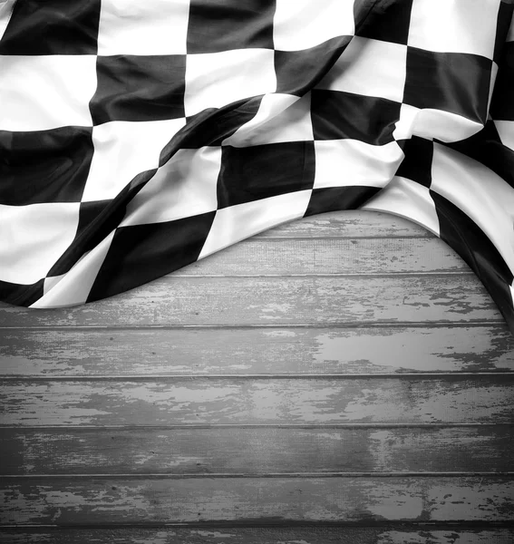 Checkered flag on wood — Stock Photo, Image