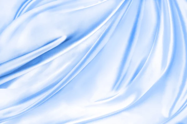 Blauwe zijdeachtige stof — Stockfoto
