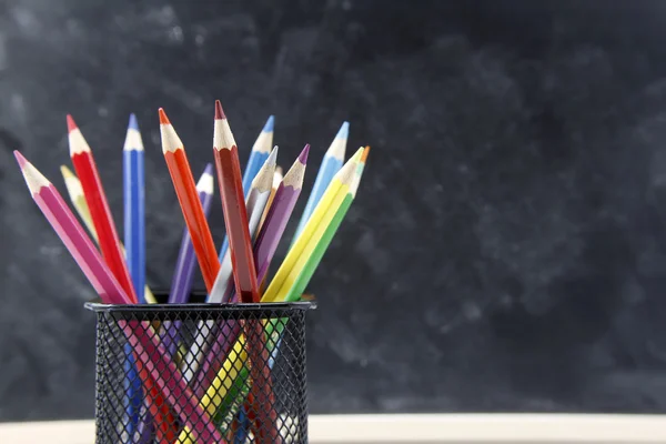 Pencils and blackboard — Stock Photo, Image