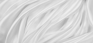 Dalgalanan beyaz ipek kumaş çizgilerinin yakınlaştırılması