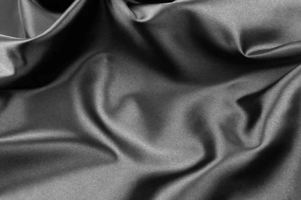 Closeup of rippled black silk fabric