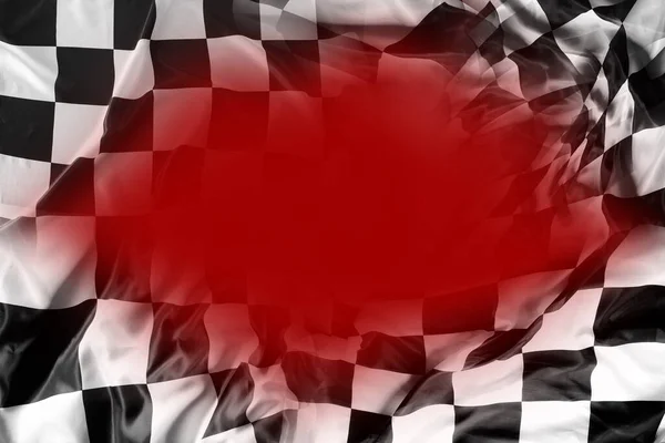 Checkered black and white flag on red background. Copy spac