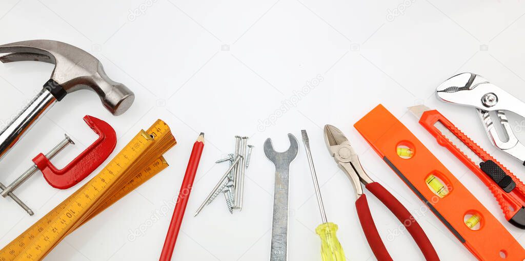 Assortment of tools on plain background