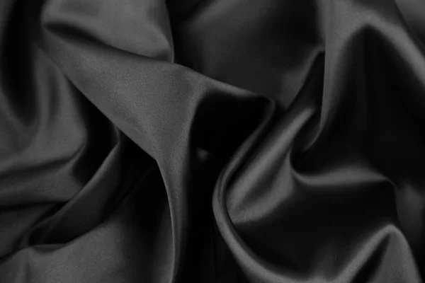 Zbliżenie Falistej Czarnej Tkaniny Jedwabnej — Zdjęcie stockowe