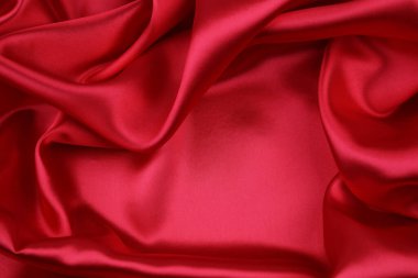 Dalgalanan kırmızı ipek kumaşın yakınlaştırılması 