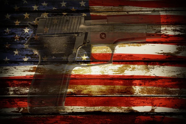 Gun and flag — Stock Photo, Image