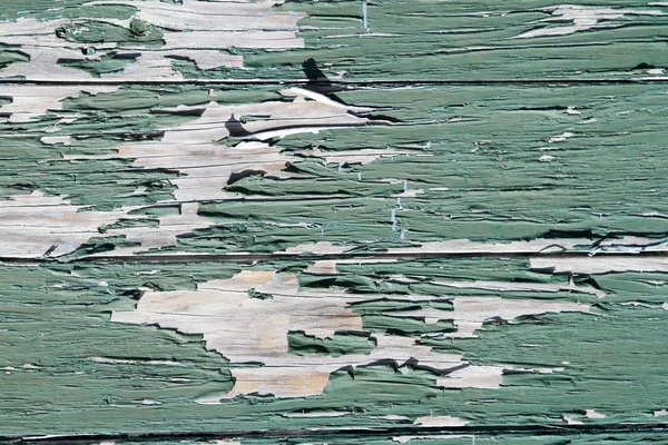 Flaking green paint