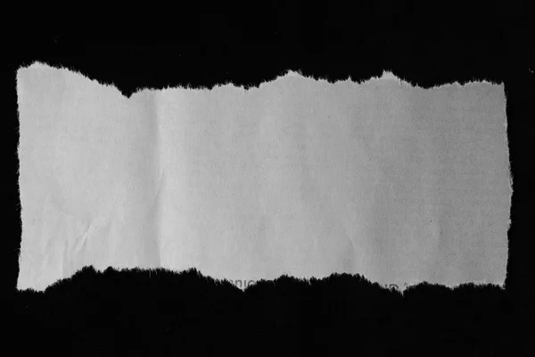 Torn paper on black — Stock Photo, Image