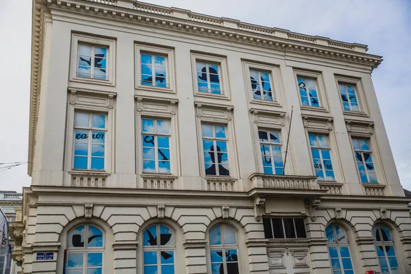 Building with shadows in the windows in Brussels, Belgium