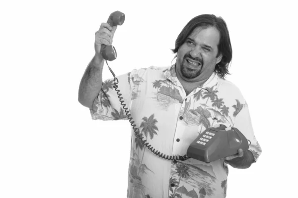 Χοντρός Καυκάσιος που δείχνει αγχωμένος κρατώντας ένα θορυβώδες τηλέφωνο — Φωτογραφία Αρχείου