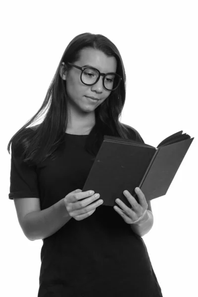 Portrait of young beautiful woman reading book with eyeglasses — Stock Photo, Image
