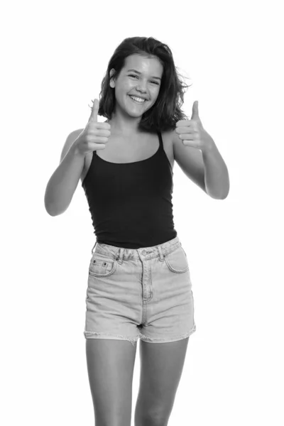 Joven feliz caucásico adolescente sonriendo y dando pulgares hacia arriba — Foto de Stock