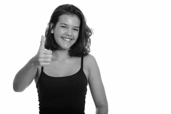 Young beautiful happy Caucasian teenage girl smiling giving thumb up — Stock Photo, Image