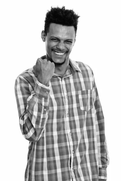 Studio shot of young happy African man smiling while looking motivated — Stock Photo, Image