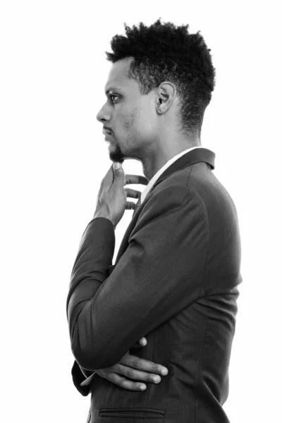 Profile view of young African businessman thinking — Stock Photo, Image