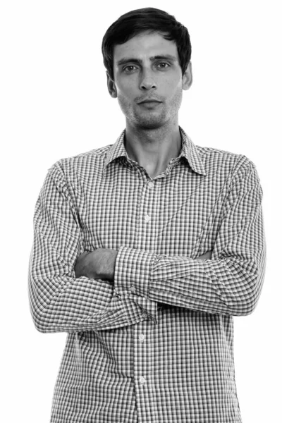 Studio shot of young handsome businessman with arms crossed — Stock Photo, Image