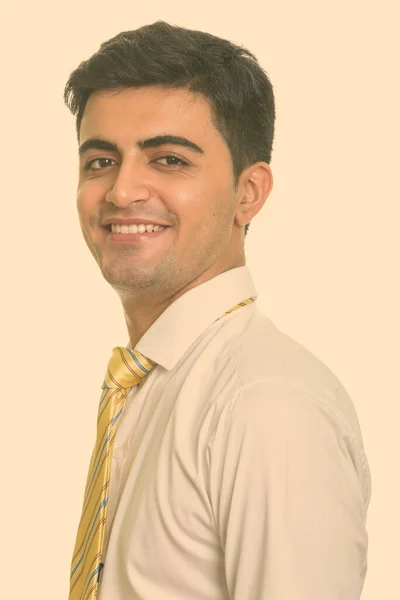 Portrait of happy young handsome Persian businessman smiling — Stock Photo, Image