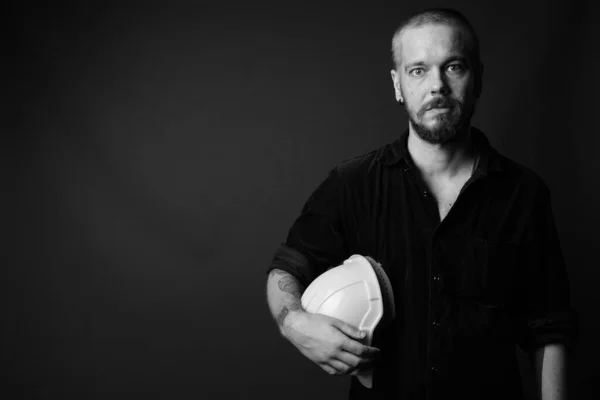 Finnish man construction worker against gray background