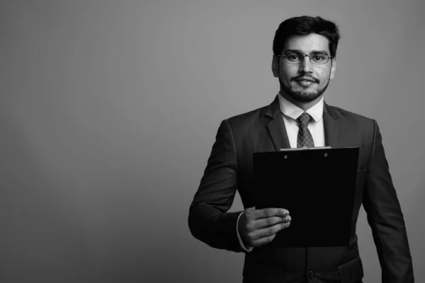 Young handsome bearded Persian businessman wearing eyeglasses — Stock Photo, Image