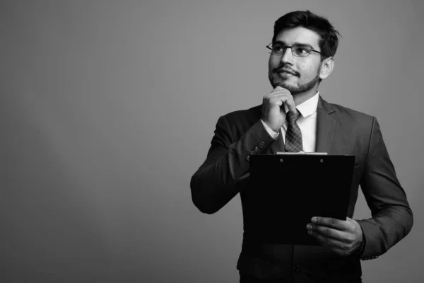 Young handsome bearded Persian businessman wearing eyeglasses — Stock Photo, Image