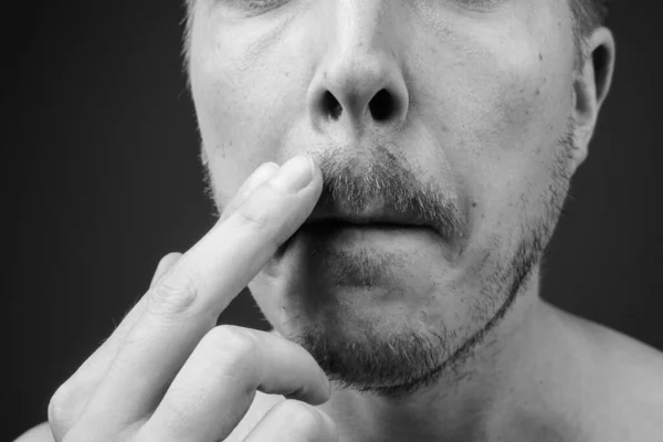 Young handsome man shirtless while grooming against gray background — Stock Photo, Image