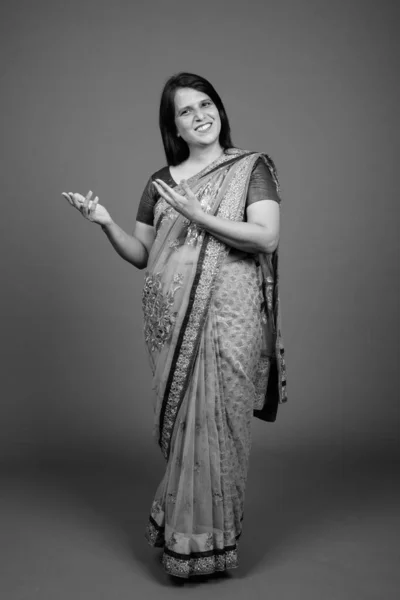 Mature Indian woman wearing Sari Indian traditional clothes