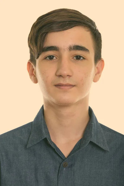 Studio shot of face of young handsome Persian teenage boy — Stock Photo, Image