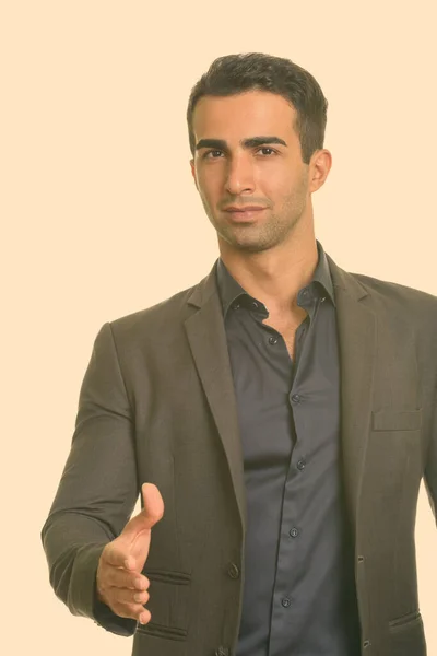 Fiatal, jóképű iráni üzletember kézfogással. — Stock Fotó