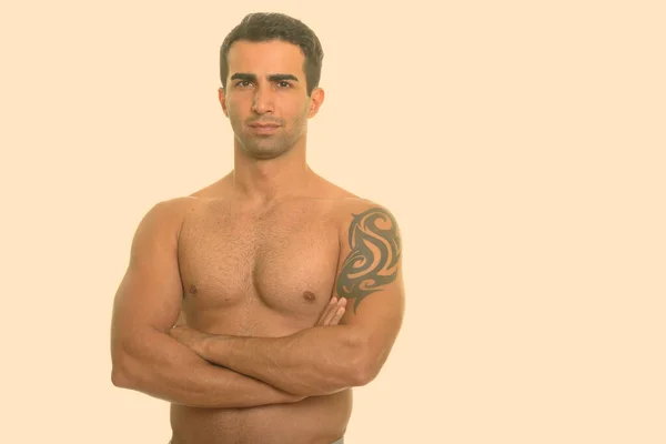 Young handsome Iranian man shirtless