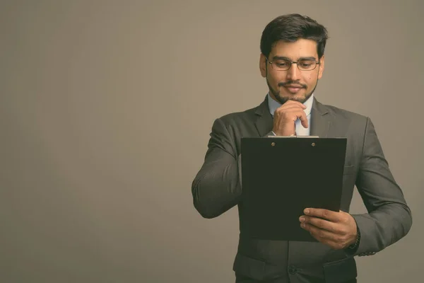 Studio Shot Young Handsome Bearded Persian Businessman Wearing Eyeglasses Gray — Stock Photo, Image