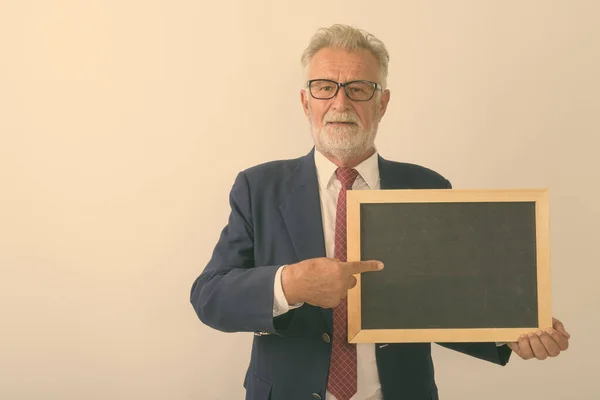 Studio Shot Handsome Senior Bearded Businessman Pointing Blank Blackboard White — Stock Photo, Image