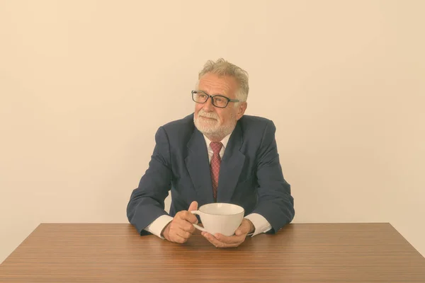 Studio Shot Handsome Senior Bearded Businessman Thinking Holding Coffee Cup — Stock Photo, Image