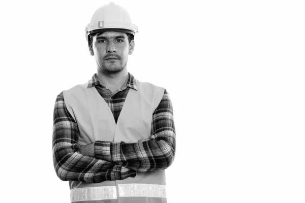 Estudio de un joven trabajador de la construcción persa con los brazos cruzados —  Fotos de Stock