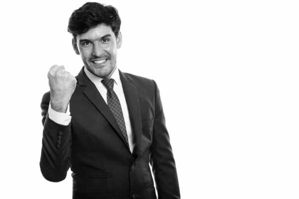 Studio colpo di giovane felice uomo d'affari persiano sorridente mentre sembra motivato — Foto Stock