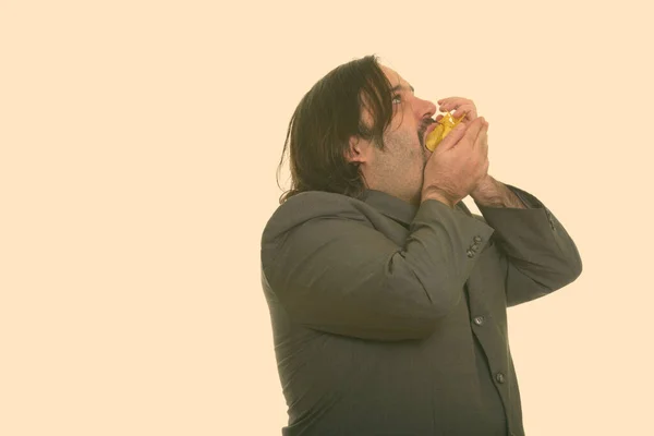 Χοντρός λευκός επιχειρηματίας τρώει τσιπς — Φωτογραφία Αρχείου