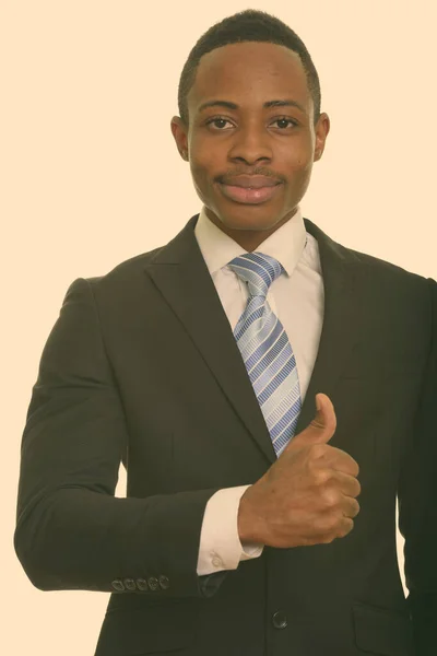 Fiatal afrikai üzletember feladja a hüvelykujját — Stock Fotó