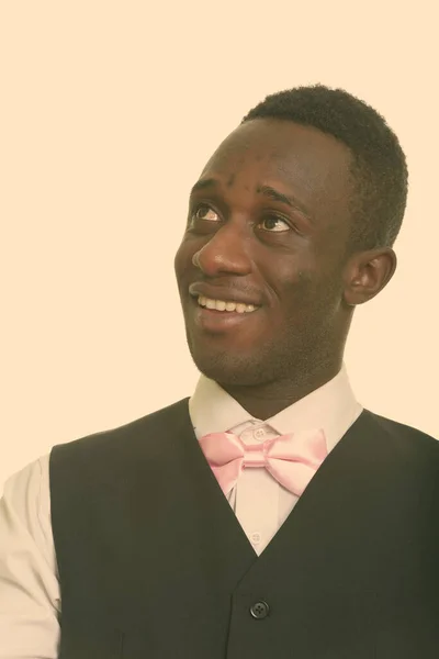 Joven camarero africano feliz sonriendo y pensando —  Fotos de Stock
