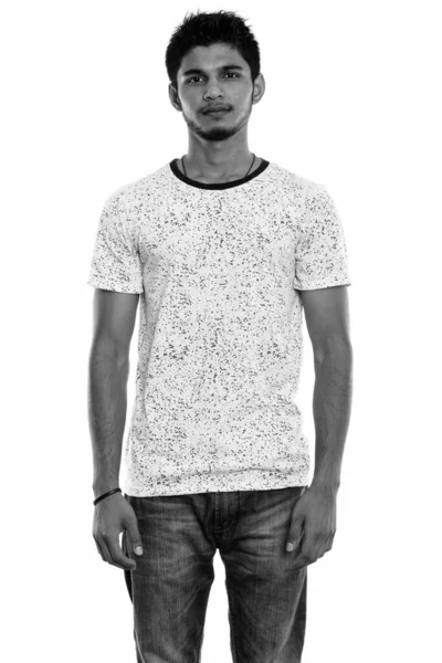 Studio shot of young handsome Indian man standing — Stock Photo, Image