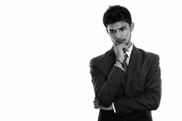 Studio colpo di giovane bel uomo d'affari indiano pensando mentre guardando verso il basso — Foto Stock