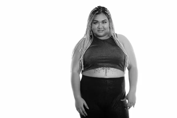 Studio shot of happy fat Asian woman smiling shot in black and white — Stock Photo, Image