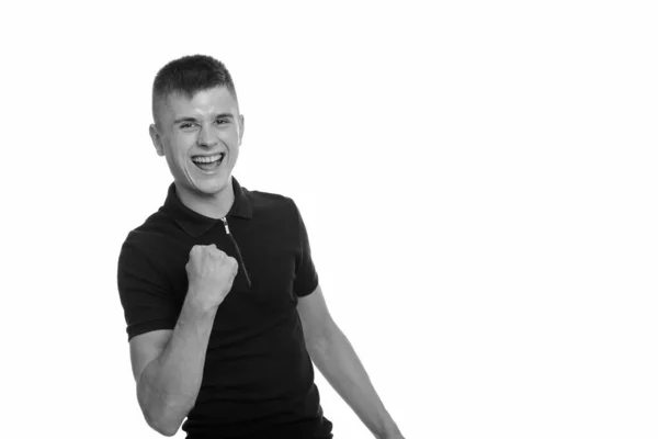 Ung glad vit man ler och ser motiverad ut — Stockfoto