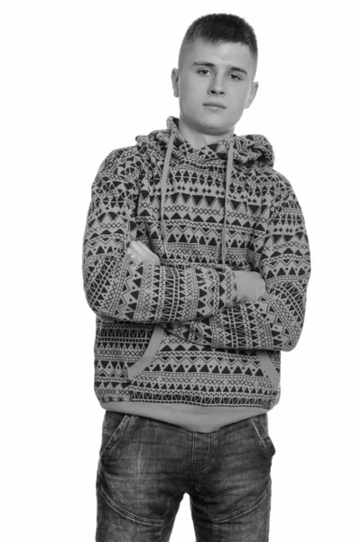 Portrait of young handsome man wearing hoodie with arms crossed — Stock Photo, Image