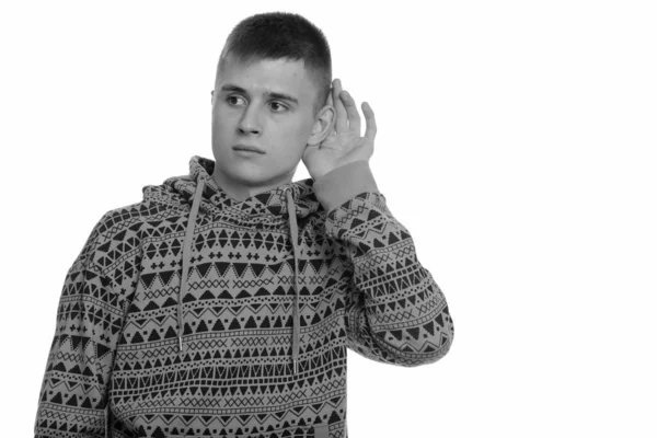 Portrait of young handsome man with hoodie listening — Stock Photo, Image