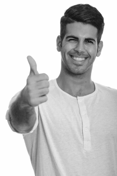 Fiatal boldog perzsa férfi mosolyog és feladja hüvelykujját — Stock Fotó