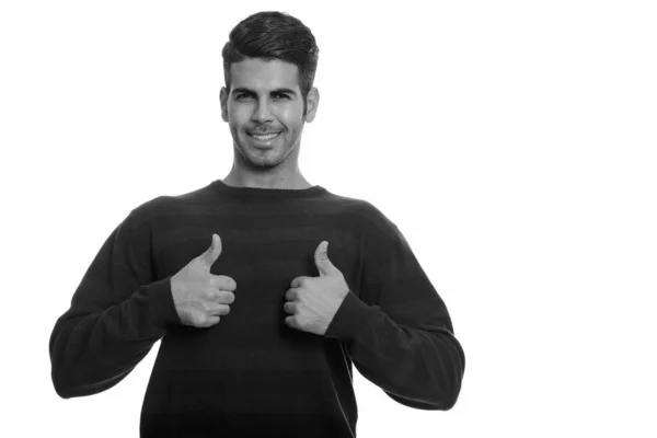 A fiatal boldog perzsa férfi mosolyog és felemeli a hüvelykujját. — Stock Fotó