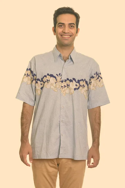 Young happy Persian man ready for vacation — Stock Photo, Image