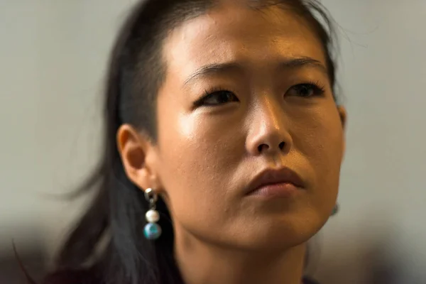 Portrait of beautiful rebel Korean woman face outdoors