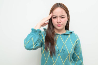 Studio portrait of a young Asian woman against white background