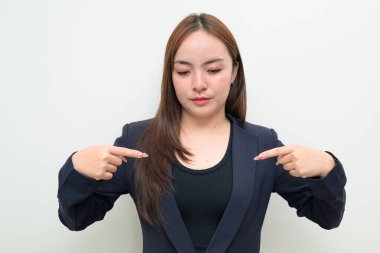 Cheerful individual pointing finger at own chest, me gesture with smile on white background